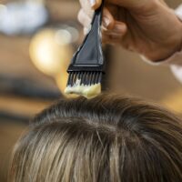 woman-getting-her-hair-dyed-home-by-hairdresser